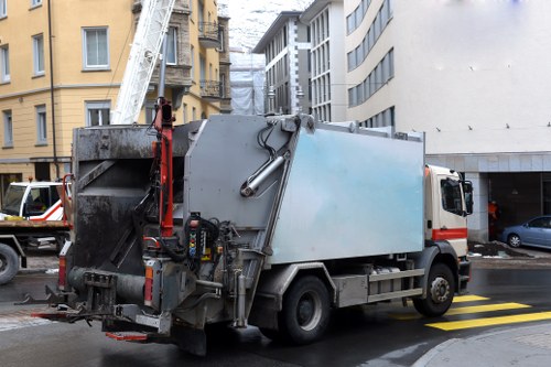 Low-emission van unloading a segregated skip for recycling